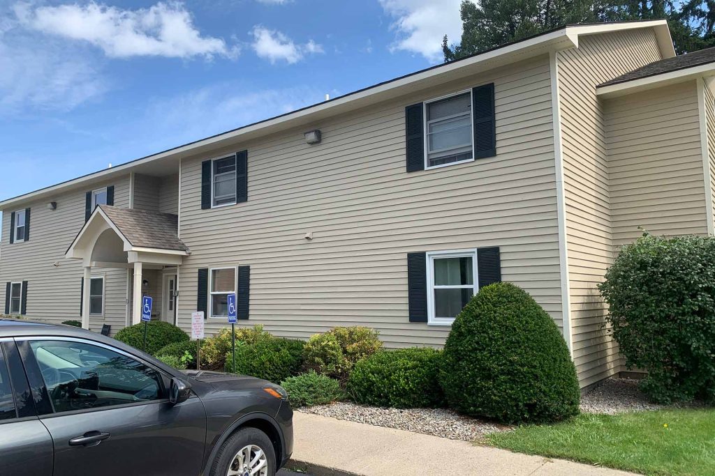 Apartments with newly painted exterior in beige by Patrick's Painting LLC